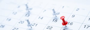 calendar with white and red pins donating dates