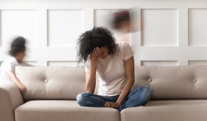 A woman experiencing chronic fatigue as a result of long covid symptoms