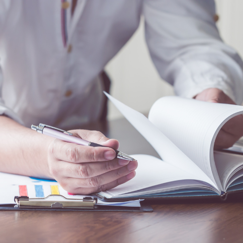 person looking at a notebook