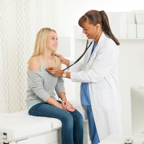 doctor with a teenage patient