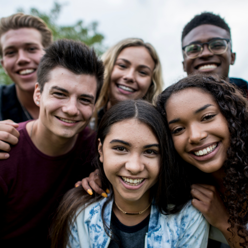 group of teens smiling at camera