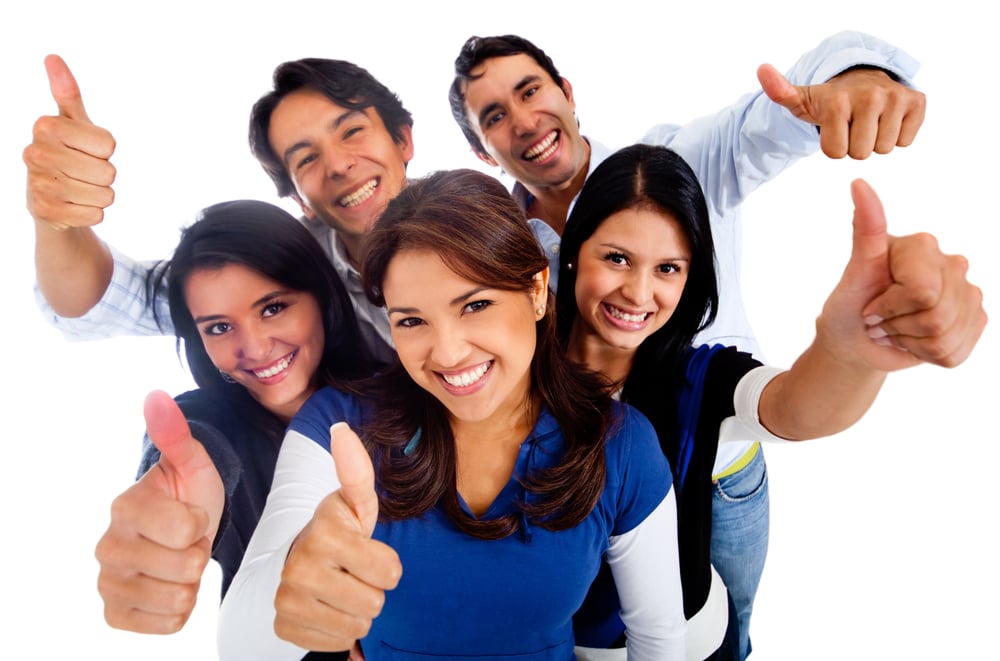 Happy group of friends with thumbs up - isolated over a white background