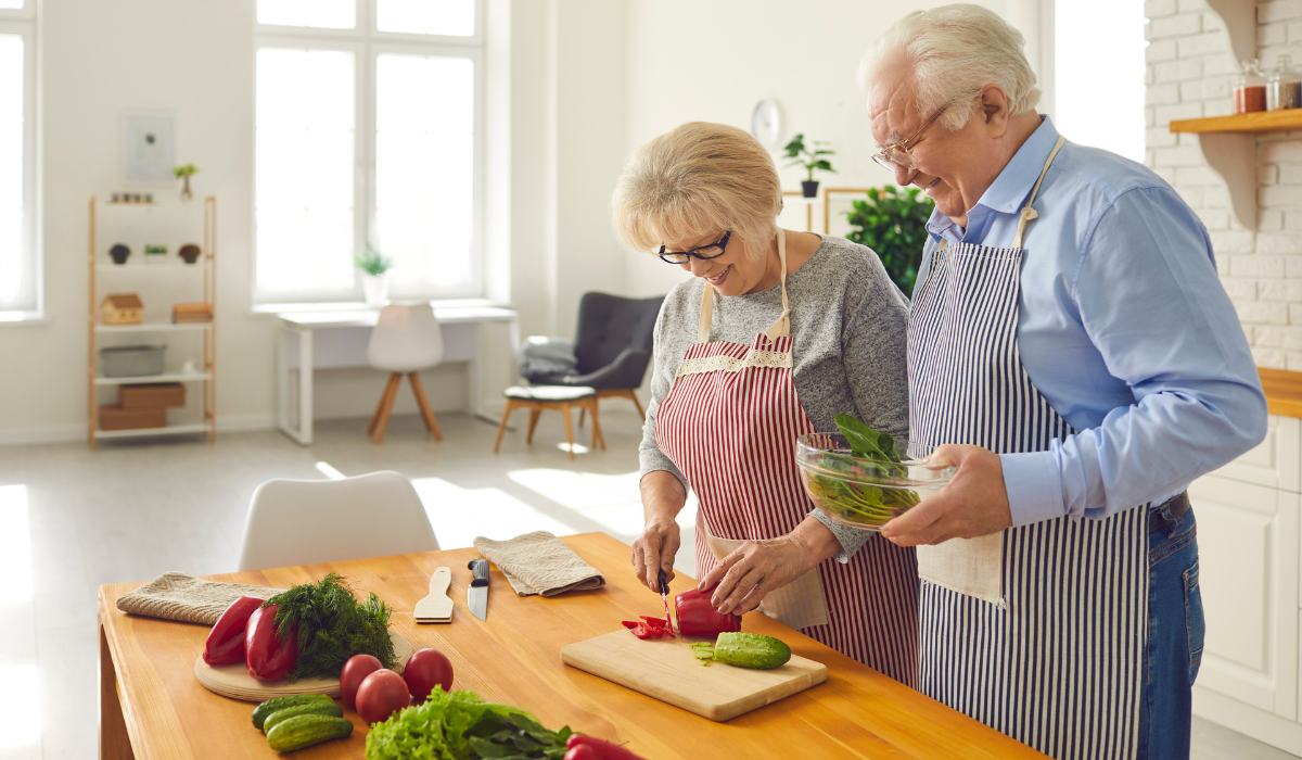 Couple preparing a kidney friendly meal with foods good for kidney health