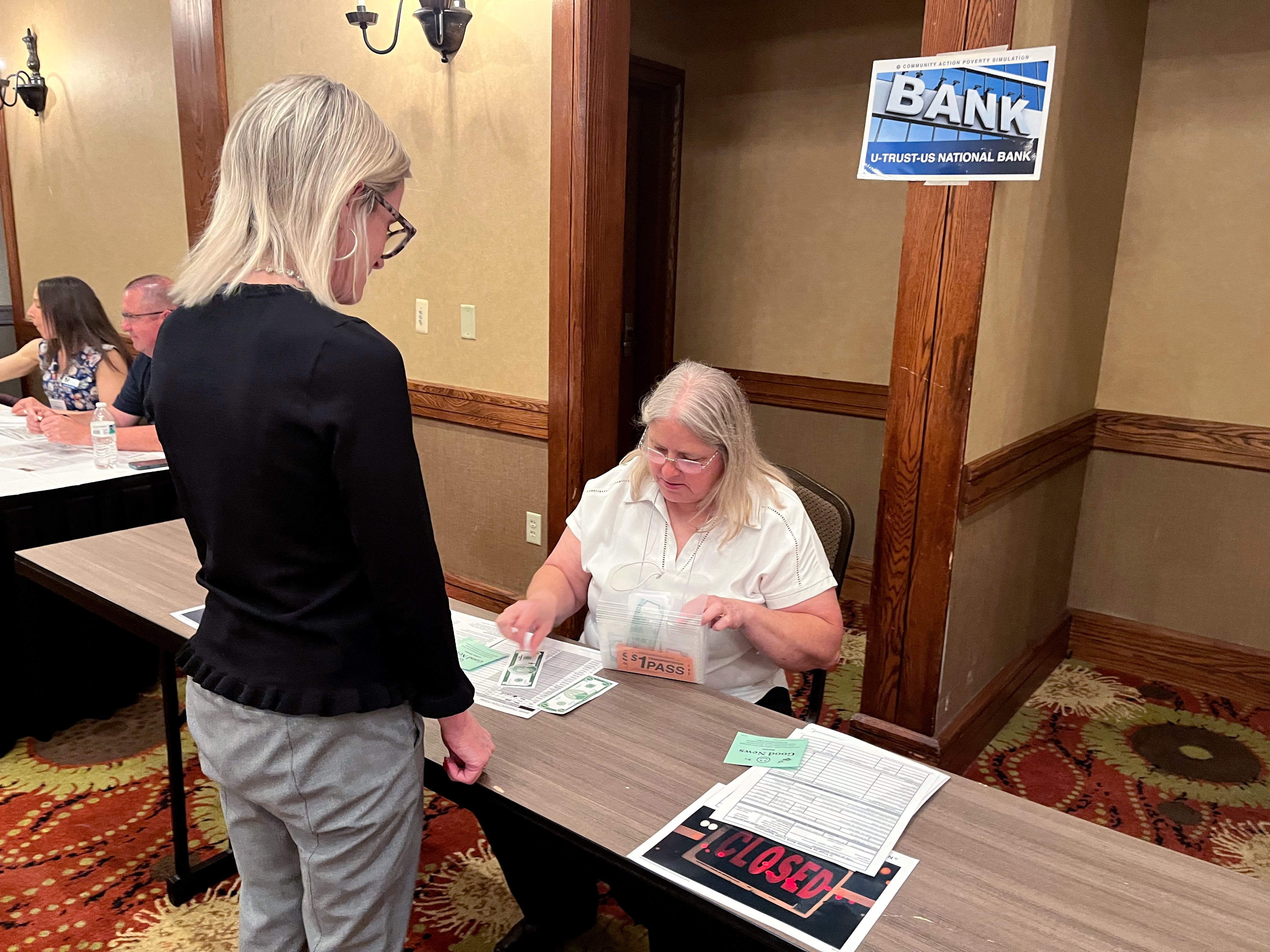 The bank table at the Quality Insights Community Action Poverty Simulator 