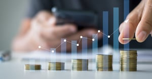 bar chart with coins showing high cost