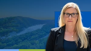 Biddy Smith headshot with mountains in the background