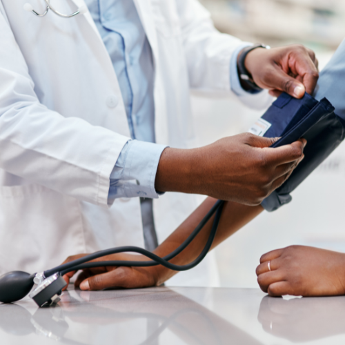 doctor measuring a patient's blood pressure