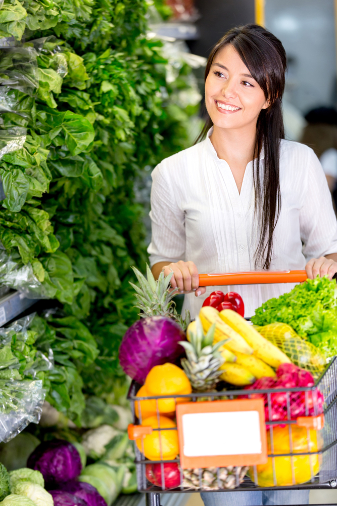 Casual woman grocery shopping at the supermarket