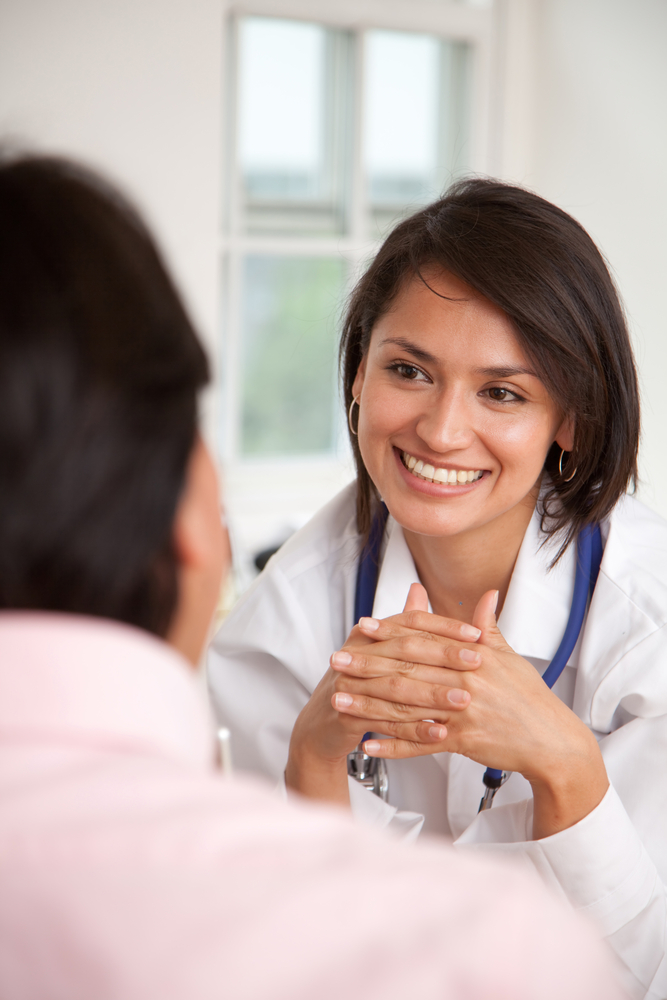 Doctor listening to a patient at her practice